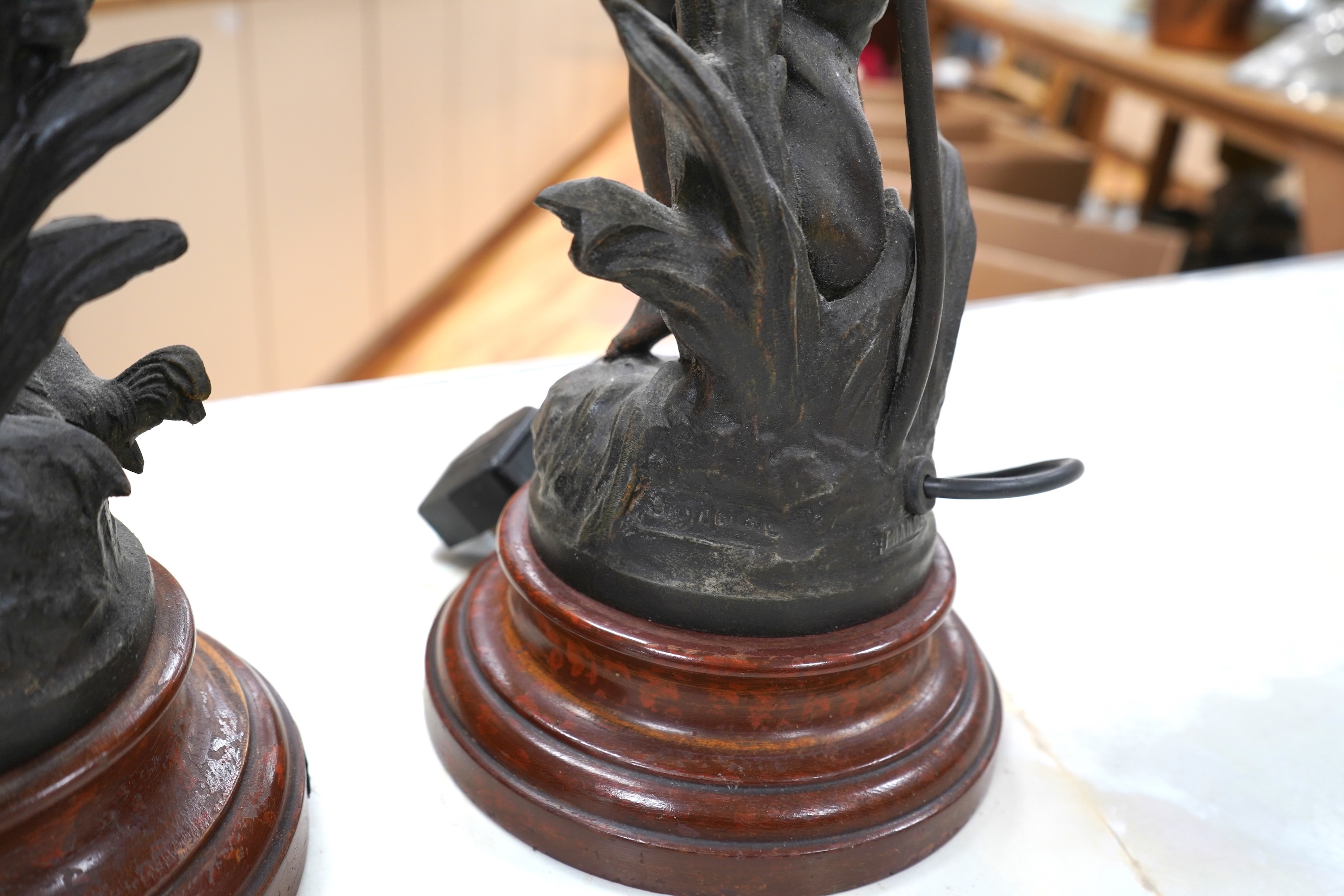 A pair of Art Nouveau style bronzed lady table lamps and glass shades, 48cm including shades and sands